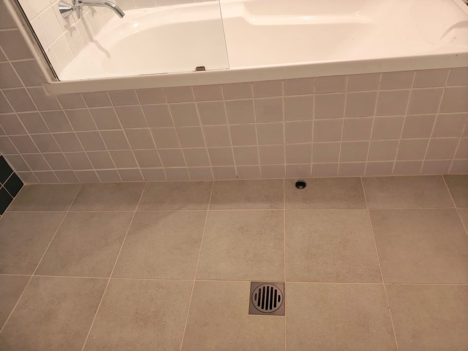 Waterproofed bathroom floor and bath surround
